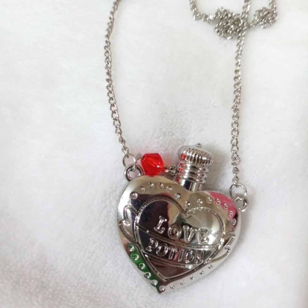 Silver tone heart love potion necklace